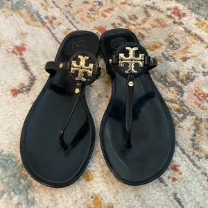 Black Tory Burch sandals with gold detail
